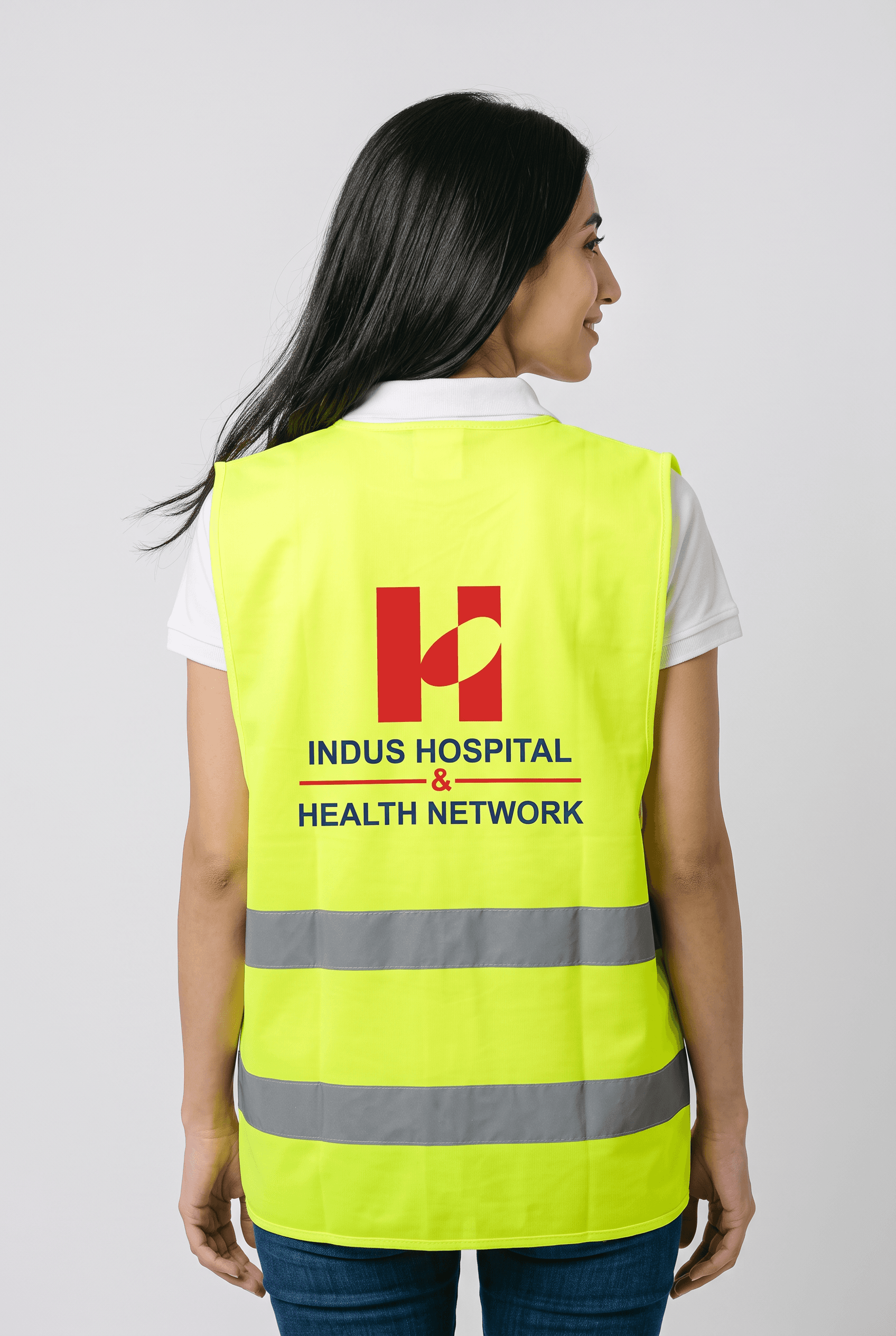 Model wearing a branded reflective safety vest